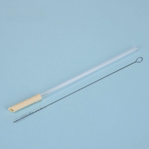 Detail of reusable Tritan straw set with cream silicone tip and metal cleaning brush