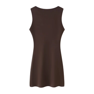 Detail view of a brown sleeveless pleated mini dress on a clean white background