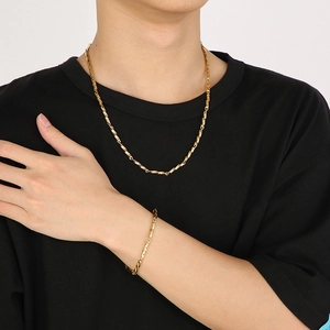 Hip hop style gold titanium steel necklace and bracelet set featuring a twisted rope chain