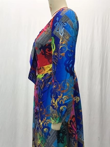 Detail of bohemian baroque print fabric on a long-sleeved split maxi dress
