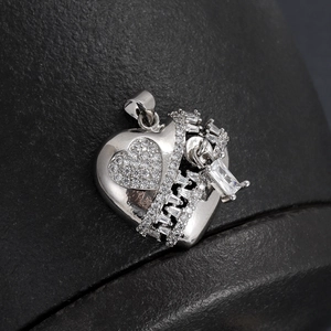 Macro detail of silver heart pendant with zipper design and micro-paved cubic zirconia