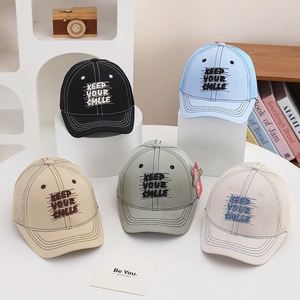 Close-up of five color baseball caps with Keep Your Smile embroidery and mesh back