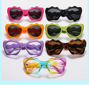 Detailed close-up of colorful wave-shaped frame sunglasses in seven vibrant color options