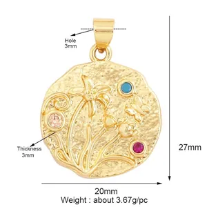 Macro detail of retro gold flower and butterfly charm pendant with colorful zircon stones