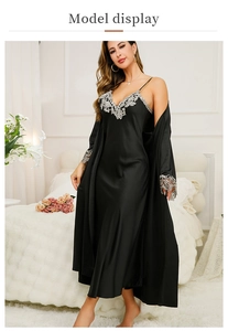 Detail of black satin nightgown set with silver floral lace trim on neckline and cuffs