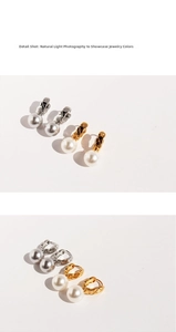 Detailed close-up of quilted pattern U-shape metal clasps and large white round pearls