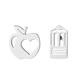 Asymmetric silver stainless steel apple and milk carton stud earrings on white background