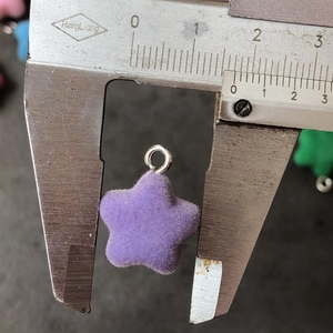Purple flocked star pendant with silver metal ring measured with a caliper, 1.8cm size
