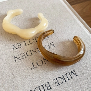 Minimalist irregular acrylic open bangle set in cream beige and amber tortoiseshell pattern