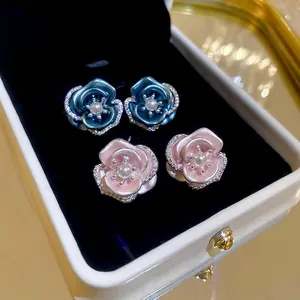 Elegant camellia flower earrings with pink and blue petals, pearls and crystals