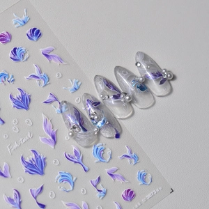 Fish tail nail art stickers featuring purple gradient scales and ocean shell patterns