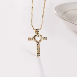 Golden box chain necklace featuring a colorful zircon cross pendant with heart cutout