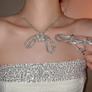 Elegant rhinestone bow jewelry set with pearl necklace and matching hair clip for women