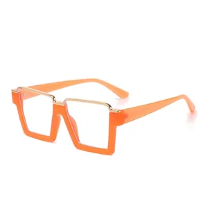Fashionable oversized square orange glasses frame with gold metal top bar and clear lenses