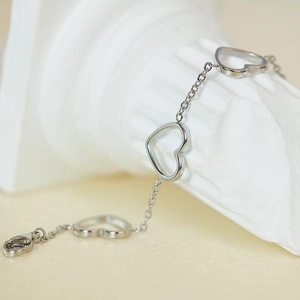 Polished stainless steel hollow heart chain bracelet with adjustable lobster clasp closure