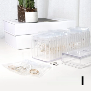 Close-up of textured acrylic jewelry box with transparent PE sealing bags for rings