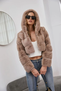 Detail of faux fur hooded jacket in dusty rose with modular embossed texture and soft finish