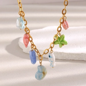 18K gold plated necklace with colorful ceramic ocean charms like sea stars and fish