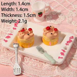Macro view of miniature resin cakes with cherry detail on a white tray, 1.4x1.4cm size