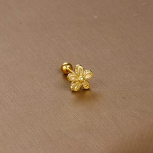 Golden flower cartilage earring with white zircon inlay and secure screw back closure