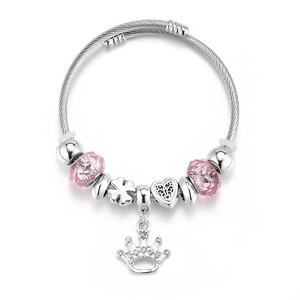Detail of adjustable crown charm bracelet with pink faceted beads and heart pendants