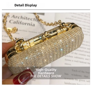 Detailed shot of golden rhinestone clutch bag with spherical clasp and metal chain