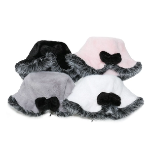 Close-up of fluffy faux fur bucket hats with elegant black bows in four colors
