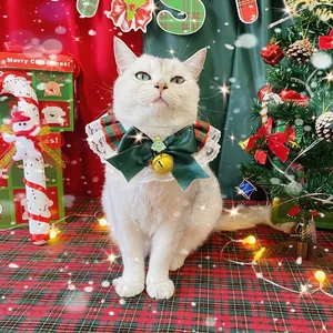 Christmas pet collar with red and green plaid bow, white lace trim and gold bell