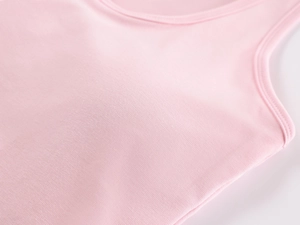 Close-up of pink sports camisole showing high-quality fabric and built-in padded cups