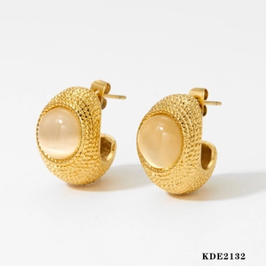 Elegant gold earrings with natural cat eye stone and vintage textured metal border