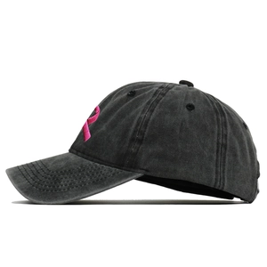 Detailed side view of washed cotton baseball cap with pink ribbon embroidery