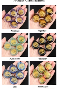 Detailed macro view of six natural teardrop gemstones with golden Tree of Life engraving