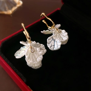 Elegant gold plated acrylic flower drop earrings with iridescent petals and clear zircon