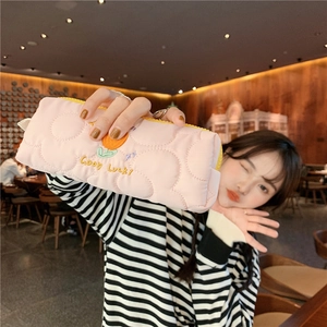 Pink quilted fabric pencil case with orange floral embroidery and Good Luck detail