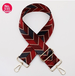 Close-up of No. 535 woven purse strap with gold hardware and red-blue zigzag pattern
