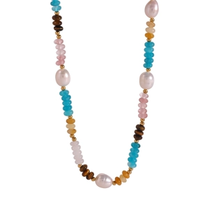 Detailed macro view of multi-color beads with natural pearls and tiger eye stones