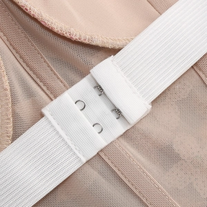 Detail of white hook-and-eye closure on breathable nude mesh fabric for slimming dress