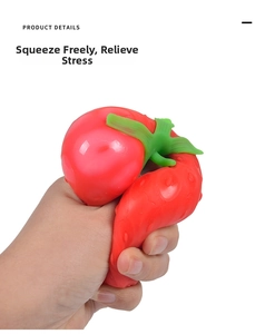 Close-up of strawberry squeeze toy showing soft texture and slow rebound flexibility