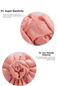 Detail of pink knitted baby headband showing elastic texture and 3D flower craft