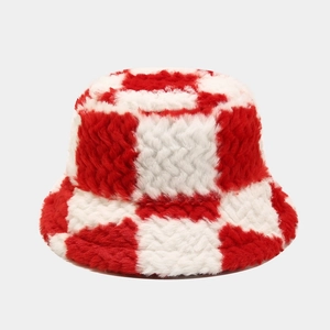 Close-up of the soft red and white checkered plush fabric on a winter bucket hat
