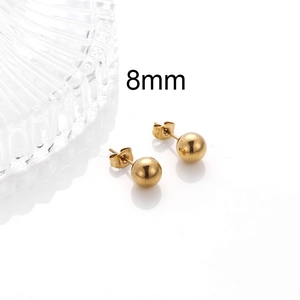 Detail view of 8mm gold stainless steel ball stud earring with polished metallic finish