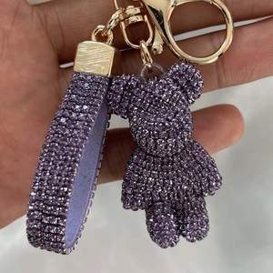 Purple rhinestone bear keychain with matching wrist strap and gold metal buckle