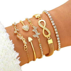5-piece gold bracelet set for women featuring heart, butterfly, and infinity symbols with crystals