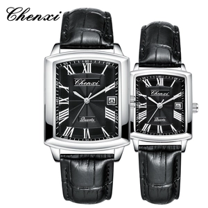 Close-up of rectangle quartz couple watches with black leather strap and Roman numerals