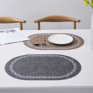 Nordic oval leather placemats in brown and grey with chain pattern for dining table