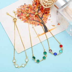 Detailed view of adjustable slider bracelets with colorful round-cut crystal gemstones