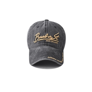 Detail of yellow Bourbon St. 3D embroidery on vintage washed cotton baseball cap