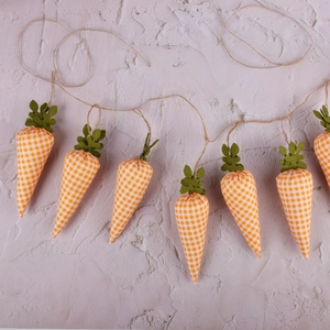 Easter carrot banner with orange plaid fabric carrots and green felt leaves hanging on rope
