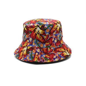 Detailed view of colorful abstract floral print bucket hat with vibrant cotton texture