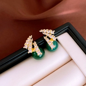 Elegant gold earrings with white cubic zirconia and green resin beads in a gift box